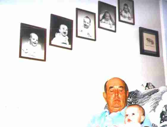 Sam with Tamara, photos on wall